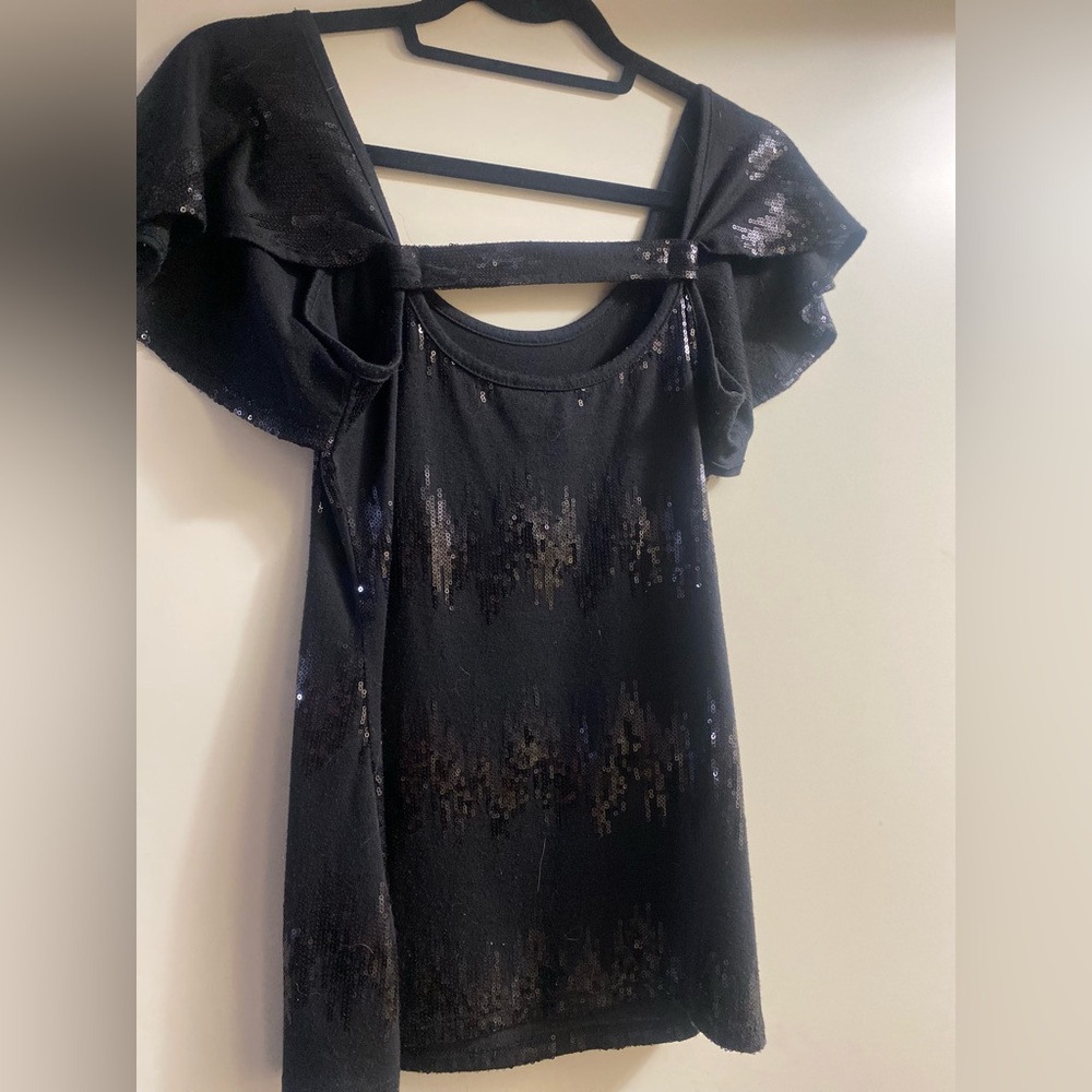 Black figure flattering top with sequence detail and cute fluttery sleeves
